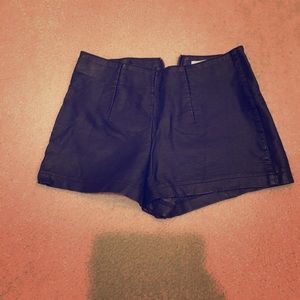 High-waisted faux leather shorts with zip-up back